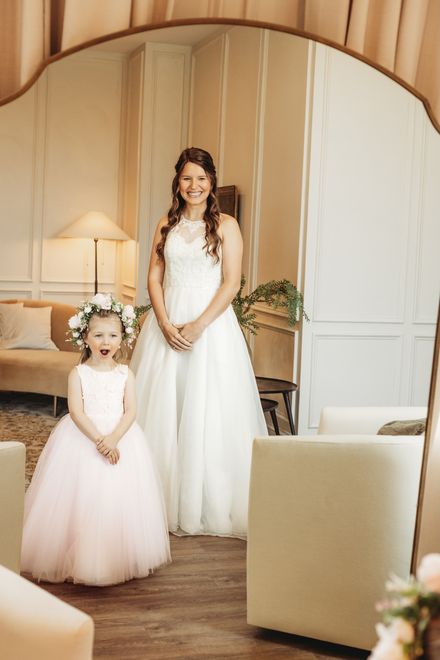 Bride with a flower girl in the bridal suite