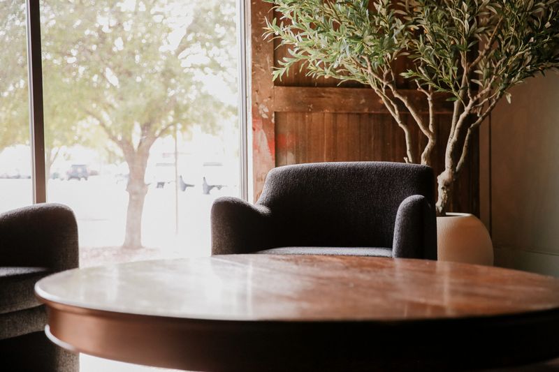 Sitting area with a round table by the front windows